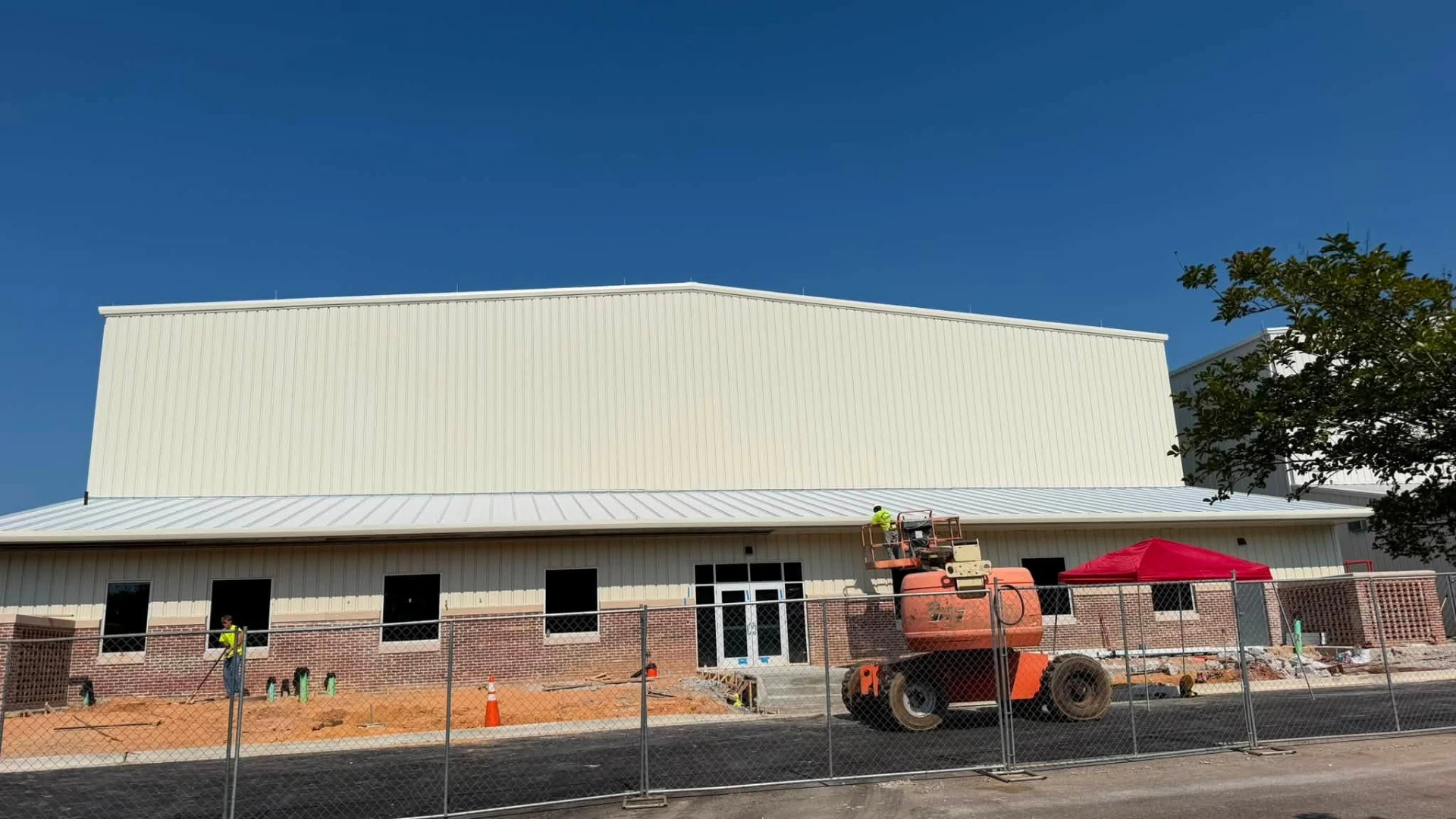 Auburn FBO hangar with metal panels and brick veneer front