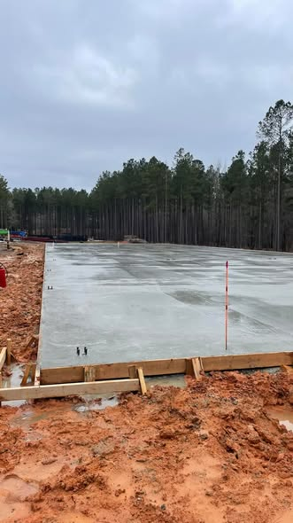 Formed and poured concrete slab for the horse barn