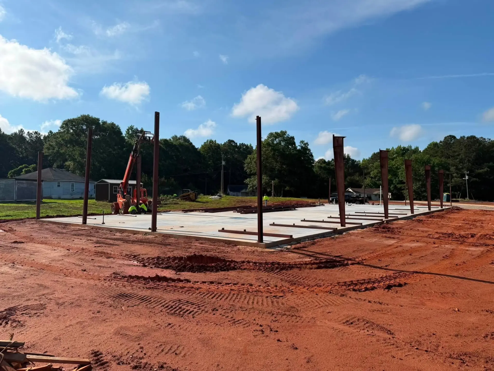 Steel columns set on a finished commercial slab