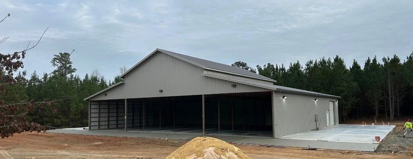 Pole Barn fabricated wing additions along with roller doors — photo 1