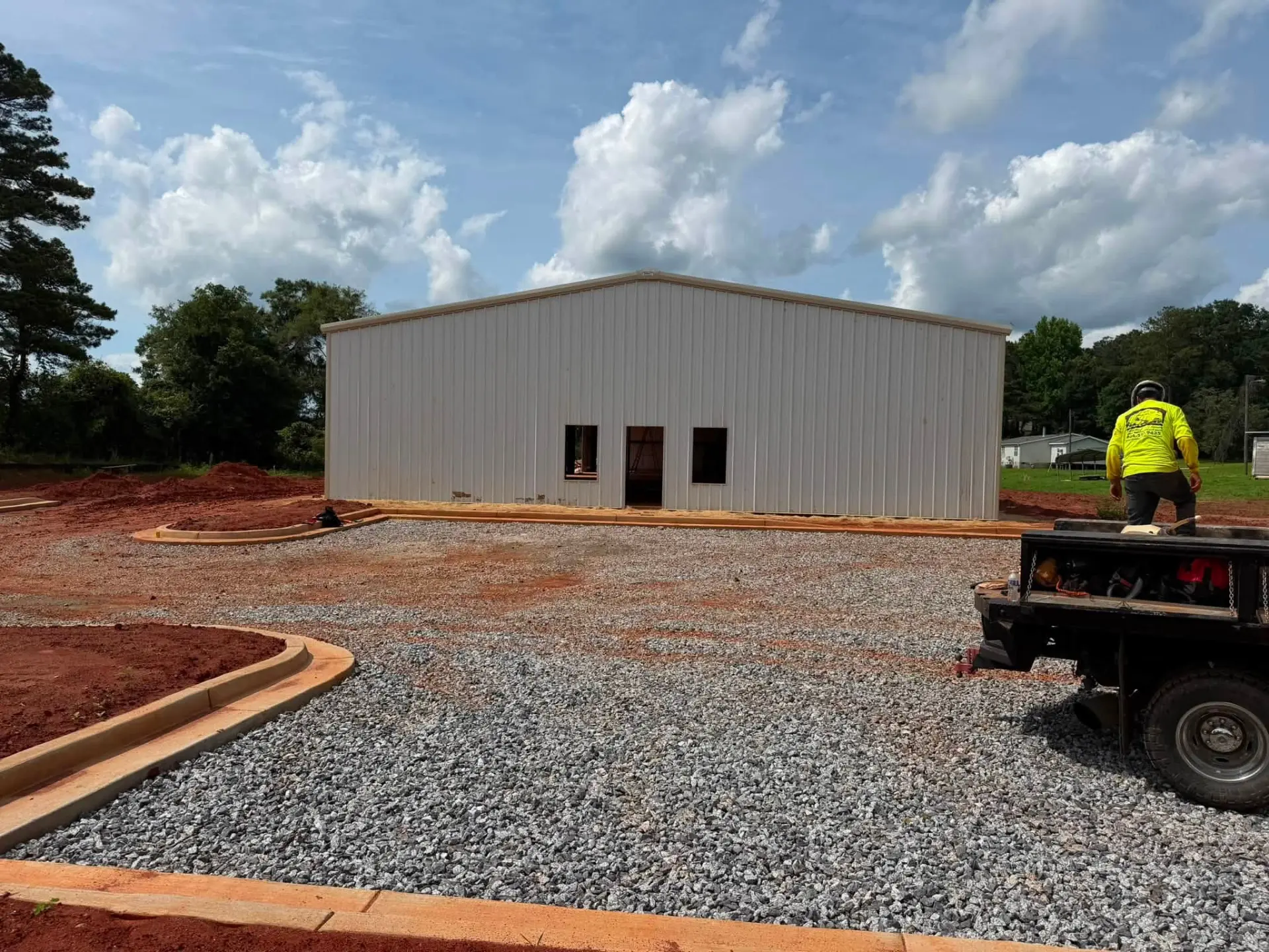 Completed metal commercial building with gravel drive