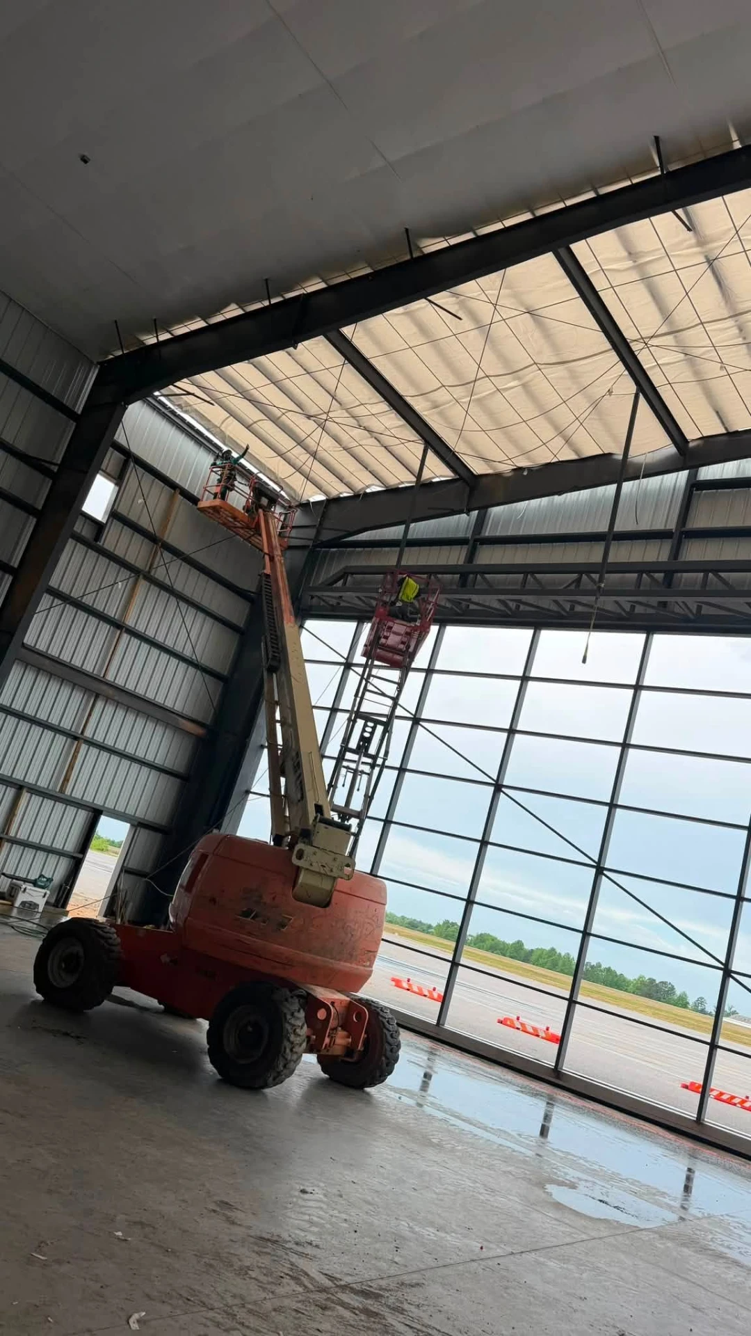 Interior of the Auburn FBO hangar with bi-fold door glass wall