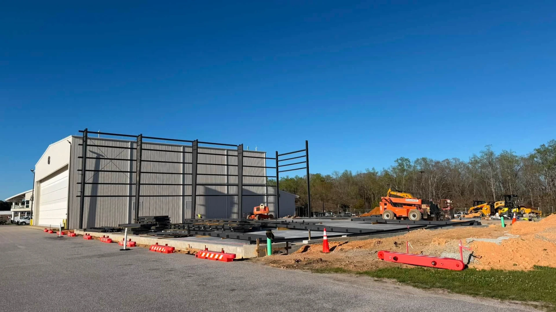Hangar framing and sheeting next to the existing FBO building