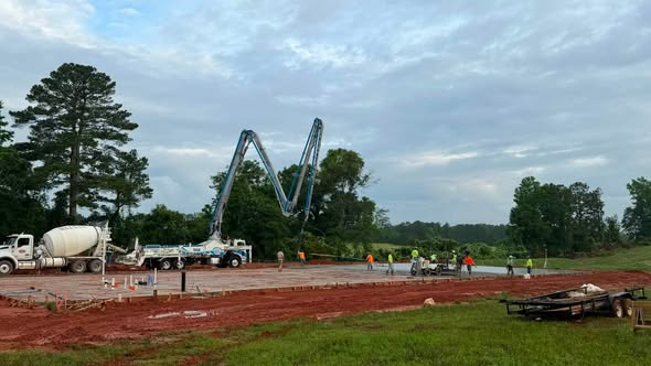 Concrete pour with boom pump on a commercial building slab