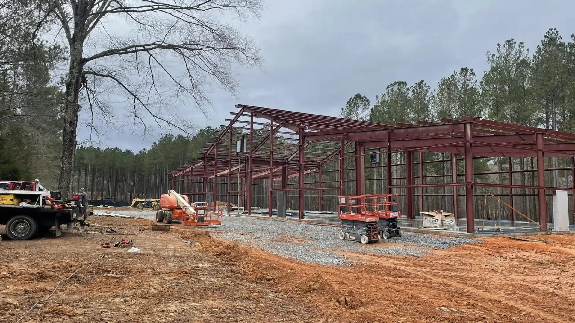 Steel frame erected for the horse barn on a cleared site
