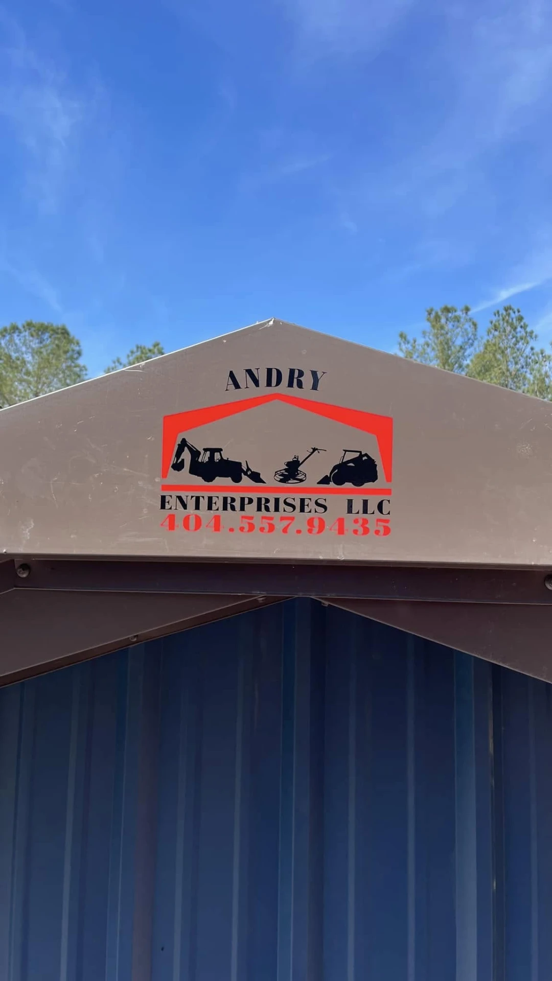 Andry Enterprises logo on the horse barn gable trim