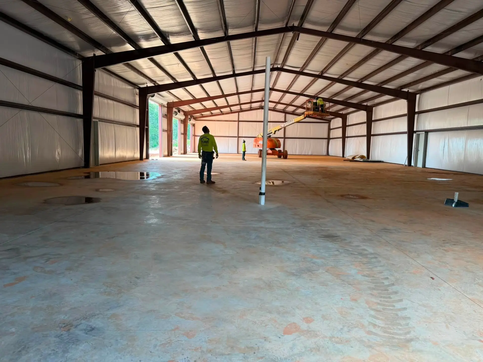 Interior of a finished commercial PEMB with concrete floor
